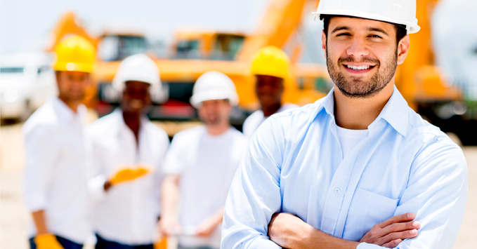 Group of Construction Workers Standing on Worksite