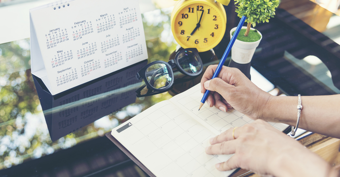 Person Using Calendar to Plan End of Year