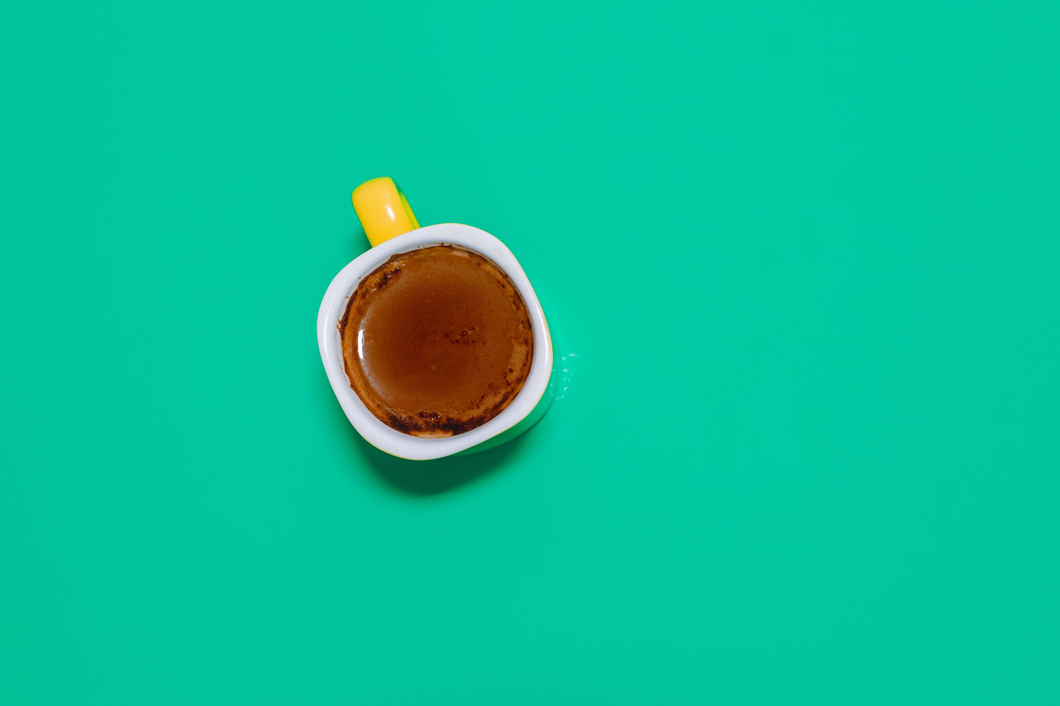 coffee in mug on green table