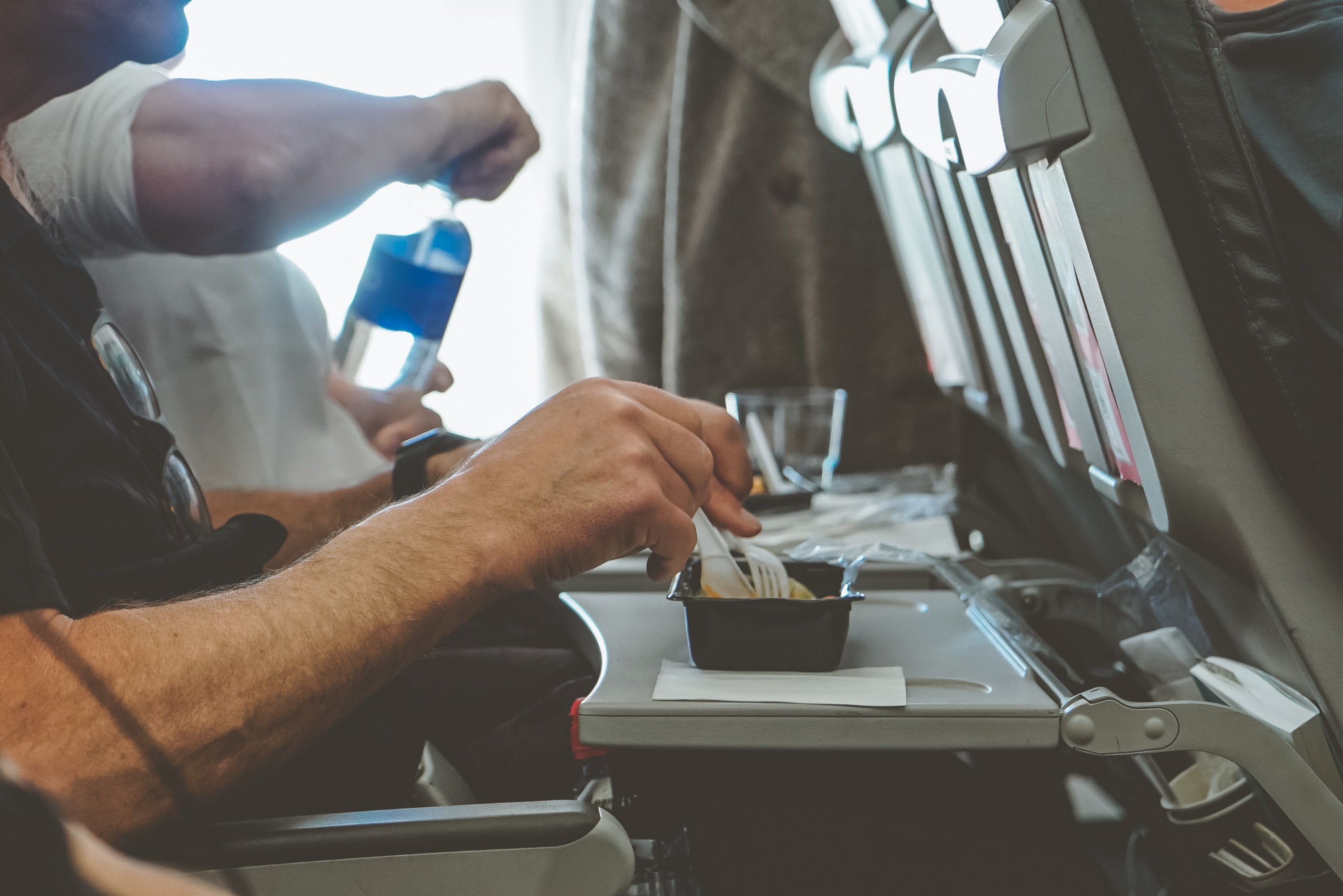Say goodbye to single-use bottles on planes and hello to branded reusable bottles!