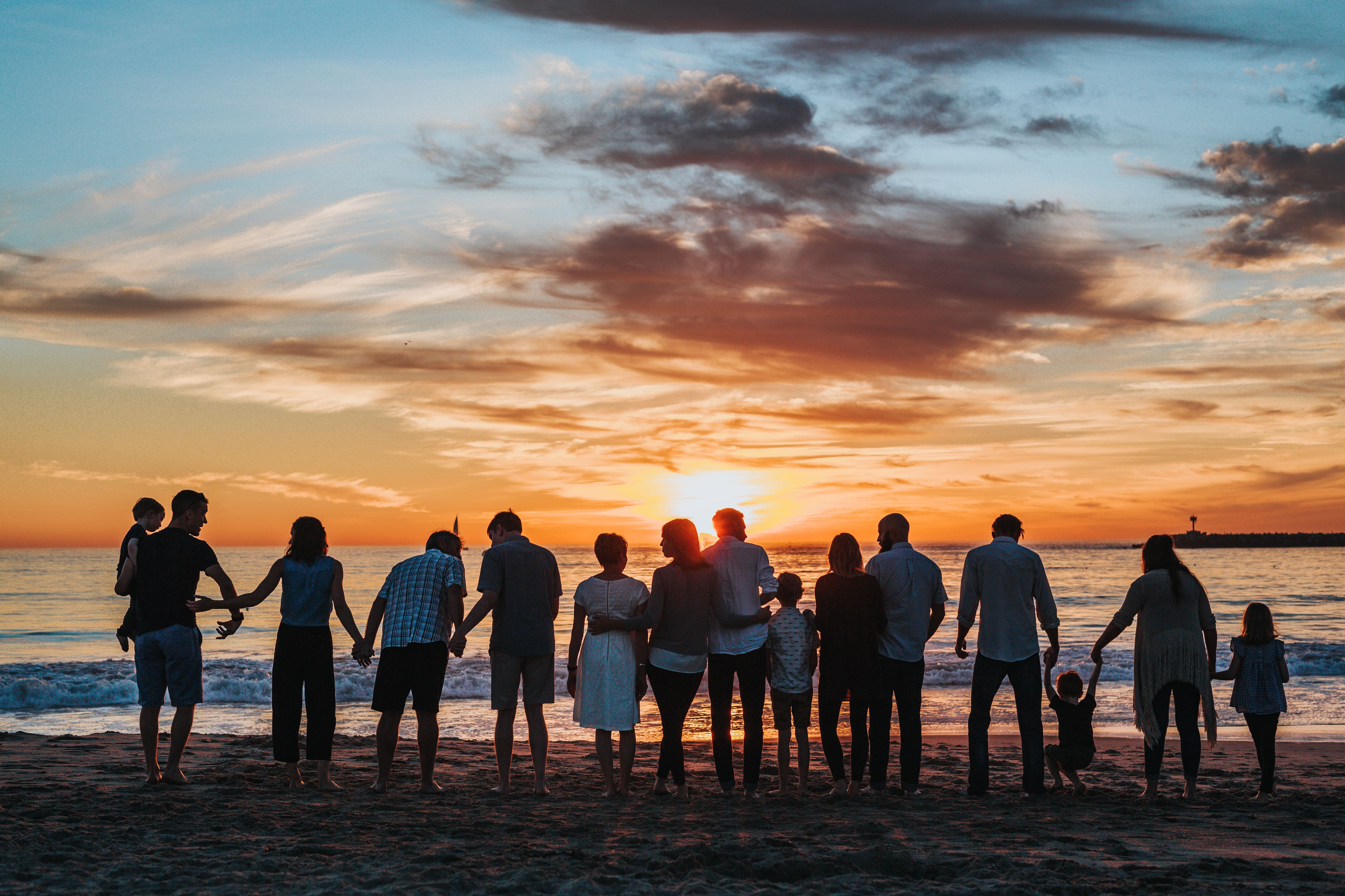 A family reunion on the beach at sunset