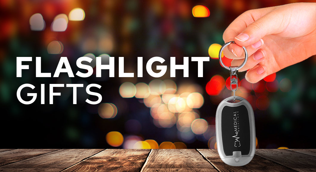 hand holding customized flashlight keychain gift with logo