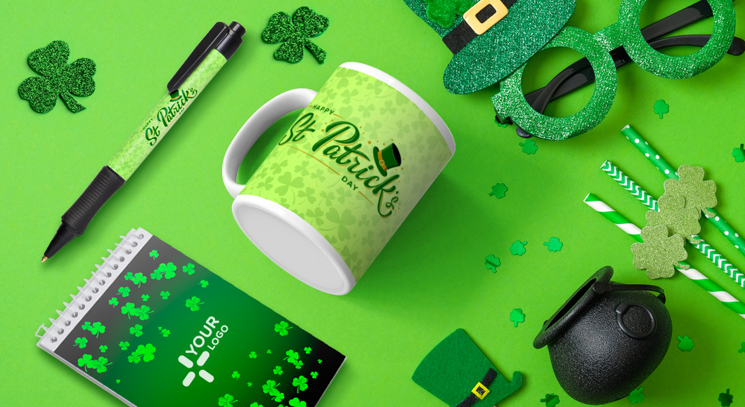 St Patrick’s Day merch and promotional items including custom green mug, spiral notebook, and pen with logo