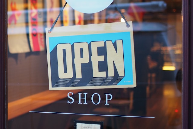 open sign on retail shop in first year of business