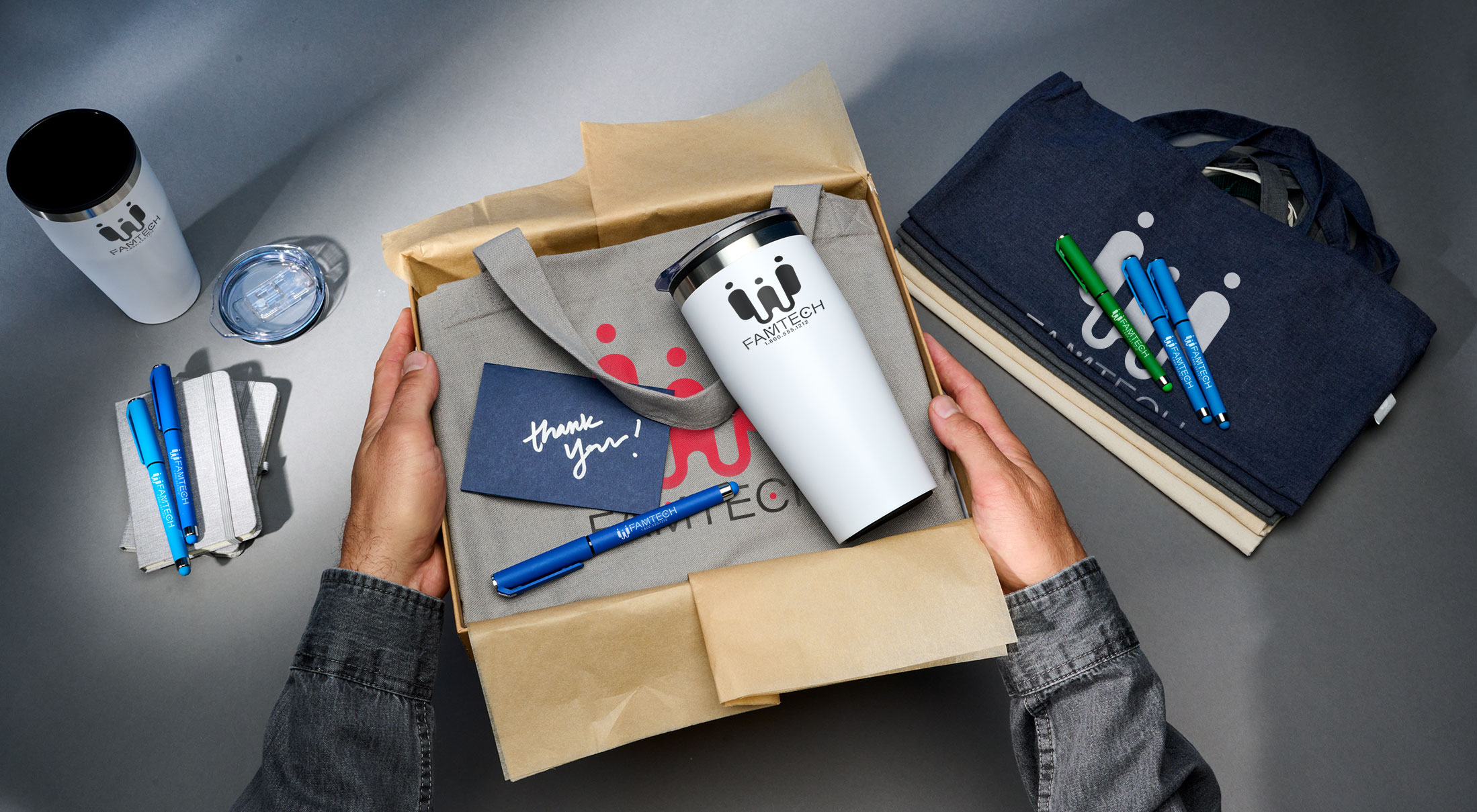 Personalized employee gifts including pens, tumblers, and stationery