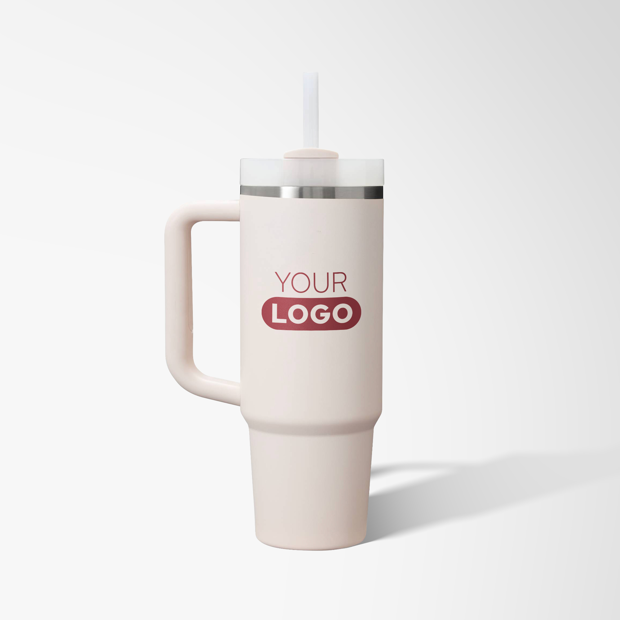 Pale pink branded Stanley travel mug.