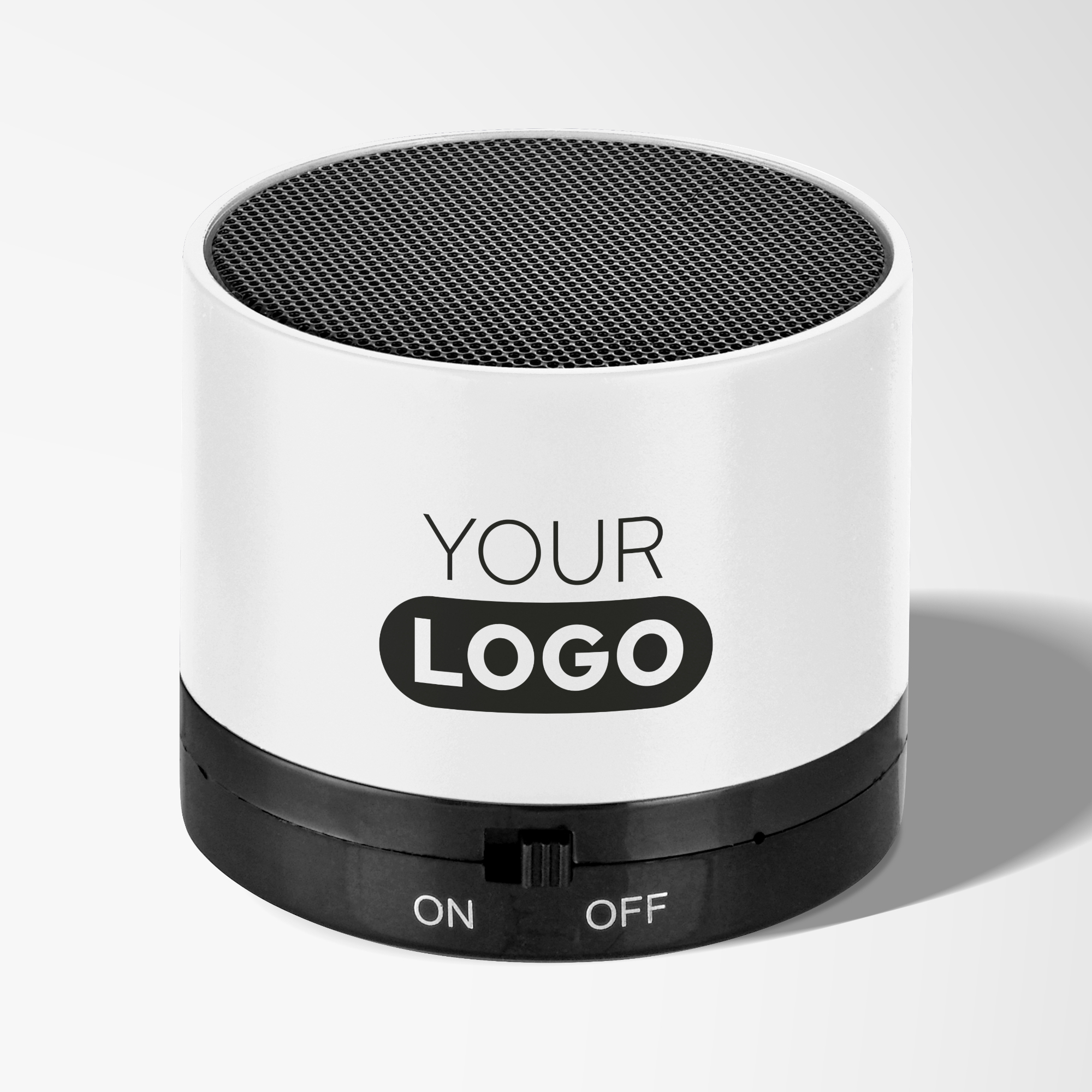 Branded black and white round bluetooth speaker.