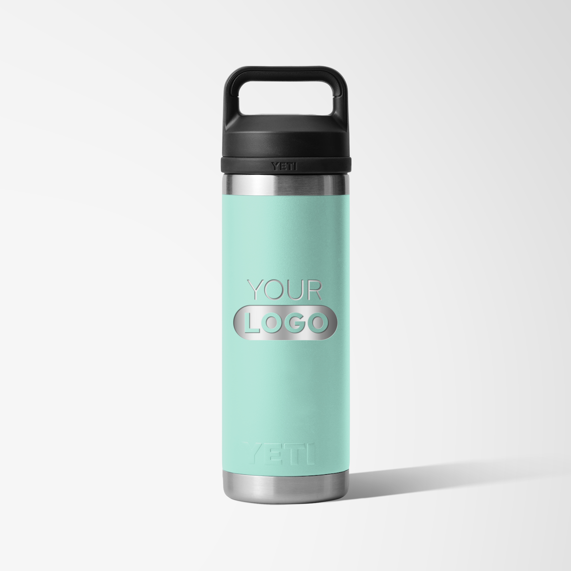 Teal branded water bottle with black lid and engraved logo.
