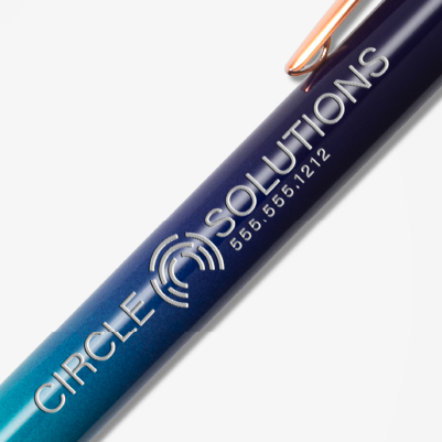 Thumbnails of promotional engraved pens -  a blue tie die colour with an engraved company brand name.