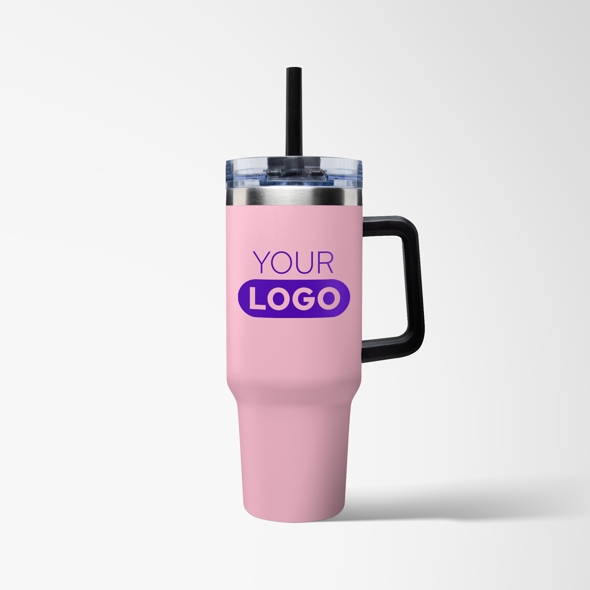Branded pink tumbler with straw and black handle.