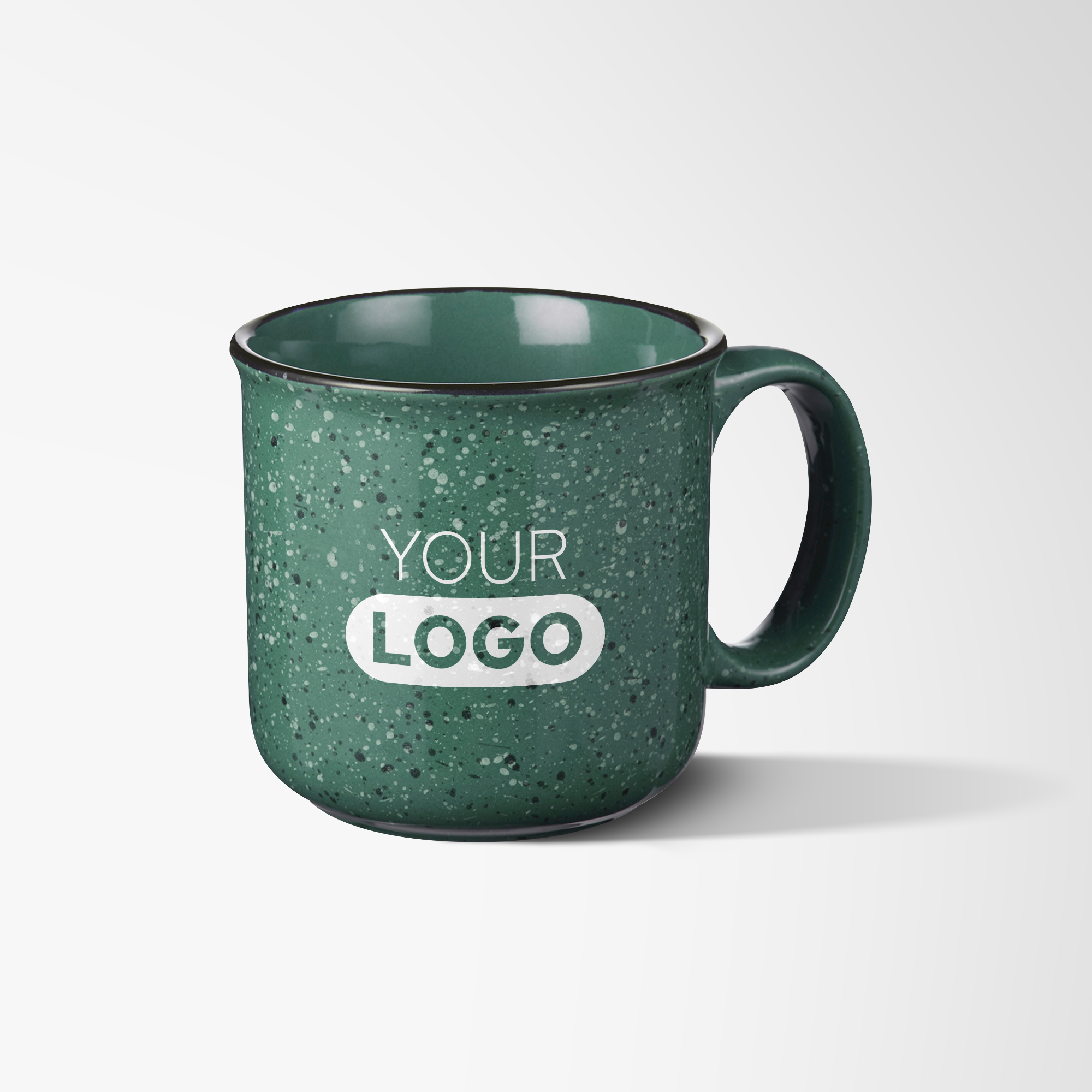Green campfire mugs with white speckled pattern and logo.