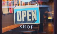 open sign on retail shop in first year of business